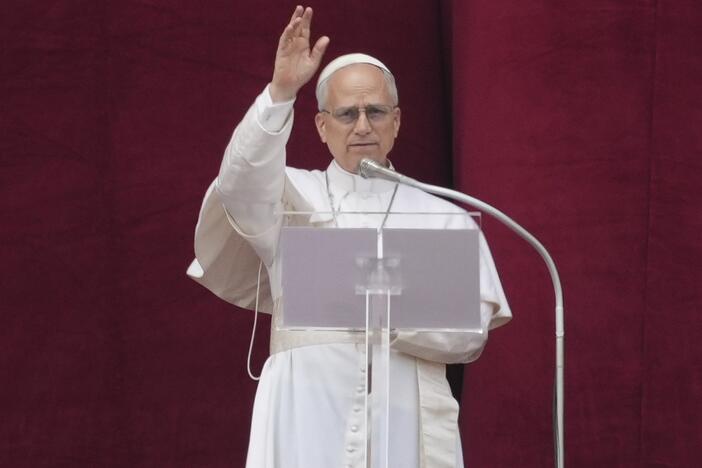 Pope Leo XIV delivers his blessing from the central balcony of St. Peter's Basilica for his first Sunday blessing after his election, in St. Peter's Square at the Vatican, Sunday, May 11, 2025.