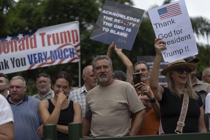 White South Africans demonstrate in support of President Trump in front of the U.S. Embassy in Pretoria, South Africa, on Feb. 15.