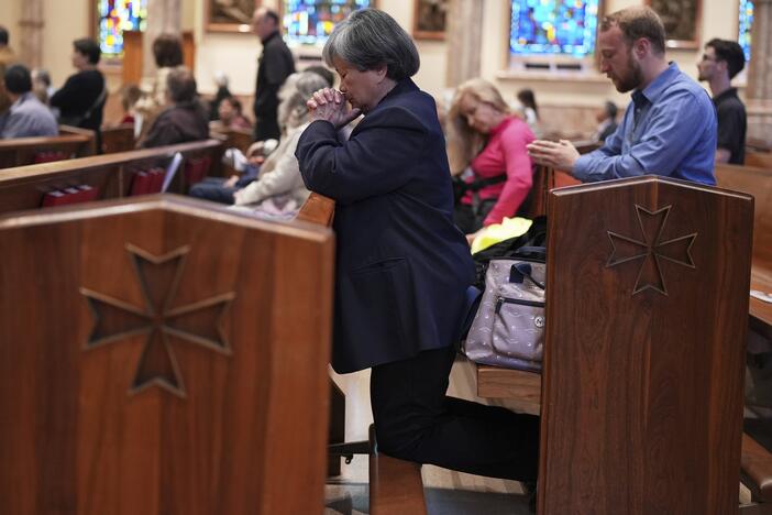 Parishioners pray during a mass at Holy Name Cathedral in Chicago on Sunday.