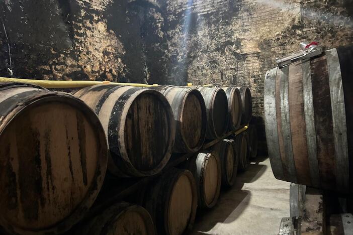 Champagne barrels line the deep, cool cellars of Charles Fourny's estate in Vertus, France. Fourny says President Trump's impending tariffs has taken away his trust in the U.S. market.