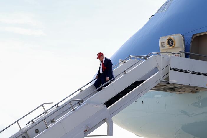 President Trump walks off Air Force One on April 29 at Selfridge Air National Guard Base, Michigan. Qatar has offered to replace Air Force One with a luxury Boeing 747 jet.