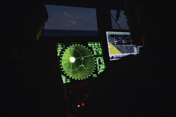 Members of the French Navy monitor radar in the control bridge in low light conditions during an anti-drug interception mission by the French surveillance frigate FS Ventose sailing off the French Caribbean island of Martinique, on November 16, 2024.