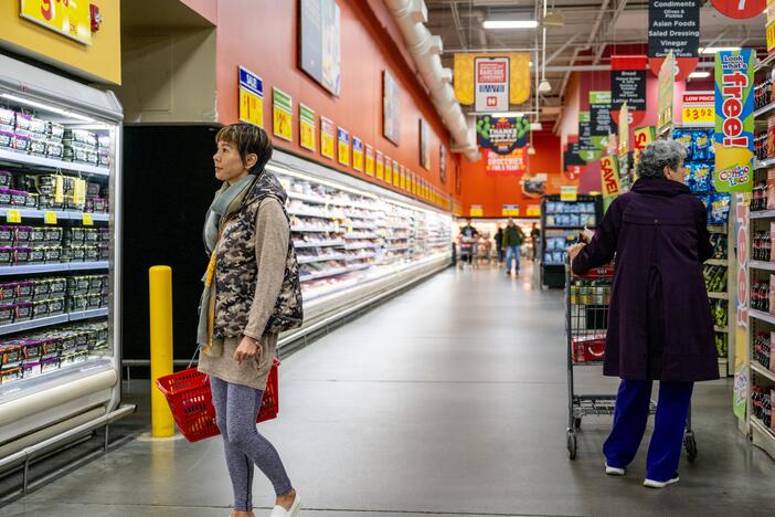 Customers shop for produce at a grocery store on Feb. 12, 2025 in Austin, Texas.