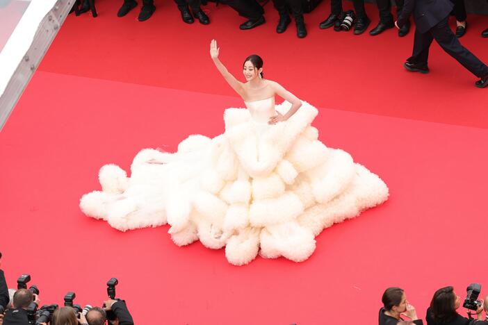 Cannes officials updated the film festival's dress code this year to ban full nudity and "voluminous" clothing. Above, actor Wan QianHui arrives for the opening ceremony on Tuesday.<br><br>