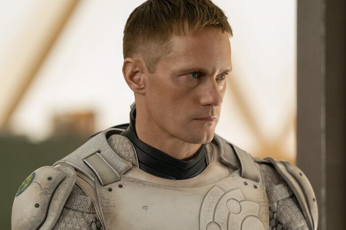 Alexander Skarsgård in <em>Murderbot</em>, which starts Friday on Apple TV+.
