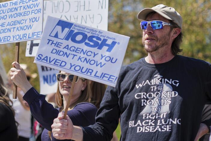 Supporters march outside a National Institute for Occupational Safety and Health facility in Morgantown, W.Va.
