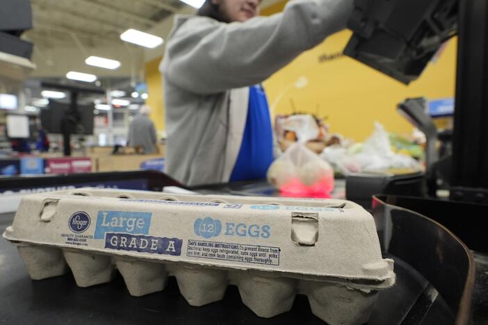 Cashier Josh Jimenez rings up egg for sale at a grocery store in Dallas.