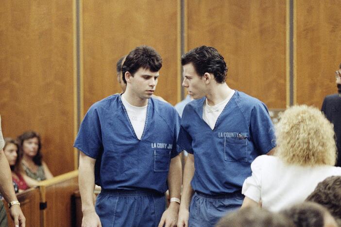 Lyle, left, and Erik Menendez leave the courtroom in Santa Monica, Calif., in August 1990. They were sentenced to life in prison without the possibility of parole in 1996 — and resentenced this week.