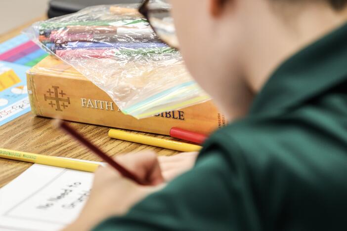 A private school student works on a lesson at St. Luke's Lutheran School in Oviedo, Fla.