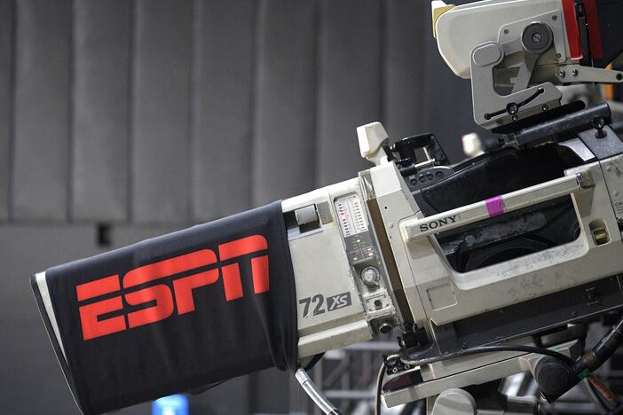 A television camera is viewed during an ESPN broadcast of a WNBA basketball game between the Connecticut Sun and the Minnesota Lynx on July 26, 2020, in Bradenton, Fla. ESPN is launching a new streaming service at $29.99 per month.
