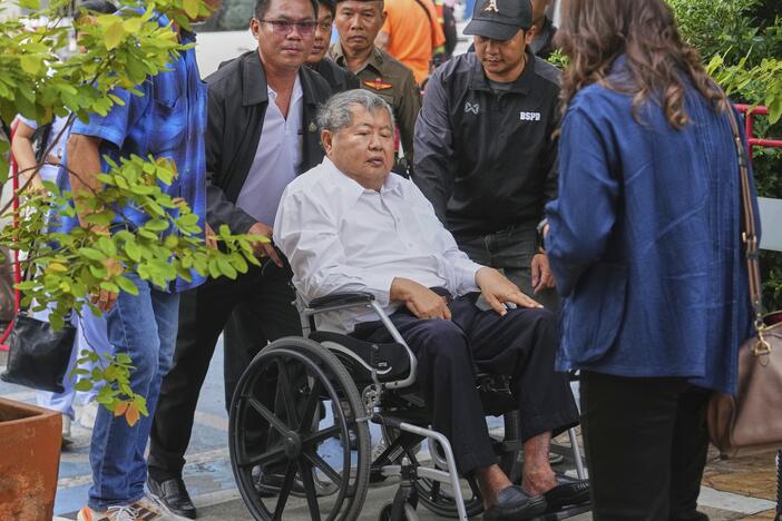 Premchai Karnasuta, the president of Italian-Thai Development Co arrives on a wheelchair at Bang Sue Police Station in Bangkok, Thailand on Friday to surrender to police on criminal negligence charges for the collapse of a Bangkok high-rise during a March 28 earthquake.
