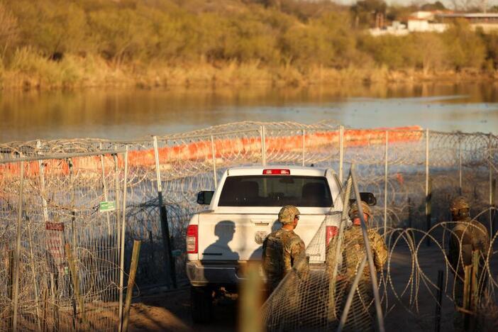 U.S. Army soldiers patrol the U.S.-Mexico border at Eagle Pass, Texas, on Jan. 24. The Trump administration has often used the word invasion to describe illegal immigration, but that framing has not been fully tested in court until now.