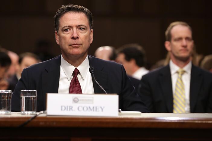 Former FBI Director James Comey, shown here testifying before the Senate Intelligence Committee in June 2017, is under fire from conservatives for a social media post some interpret as a threat to President Trump's life.