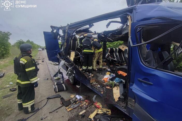 In this photo provided by the Ukrainian Emergency Service, rescuers recover the bodies of passengers after a Russian drone struck a passenger bus at the village of Bilopillya in the Sumy region, Ukraine, on Saturday.
