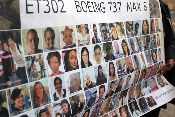Relatives of victims hold a placard with photos of victims of the Ethiopian Airlines Flight 302 crash in March 2019, prior to a hearing in Fort Worth, Texas, in January 2023.