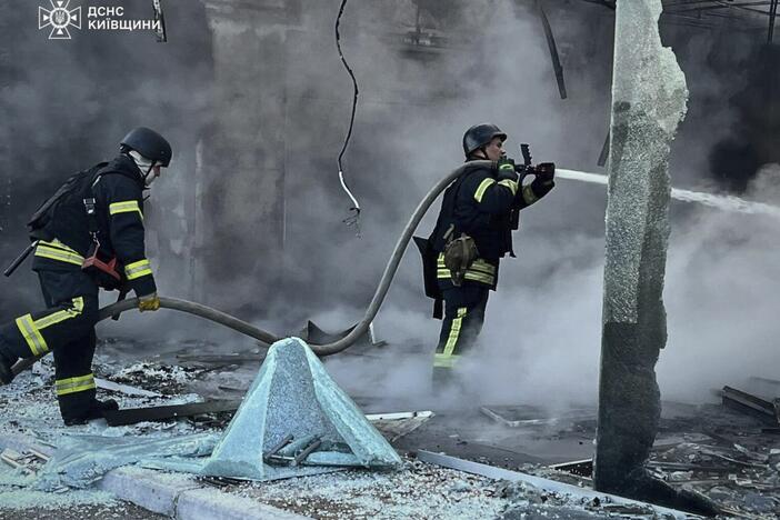 In this photo provided by the Ukrainian Emergency Service, firefighters put out the fire following Russia's drone attack in the Kyiv region, Ukraine, Sunday, May 18, 2025.