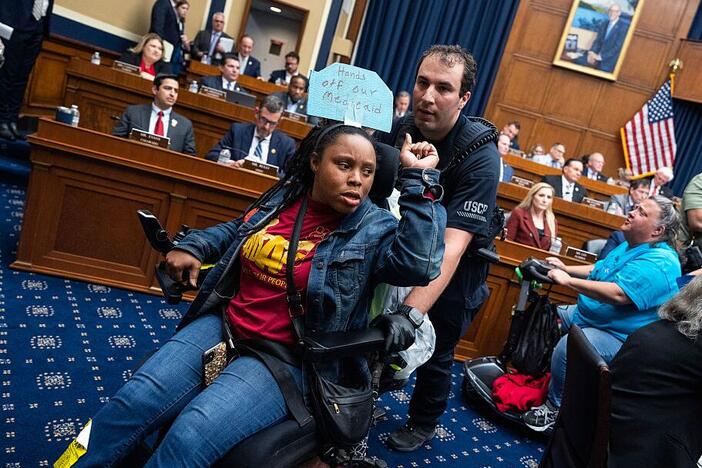 Demonstrators calling for preservation of Medicaid funding, are removed from the House Energy and Commerce markup of the budget resolution in Rayburn building on May 13.