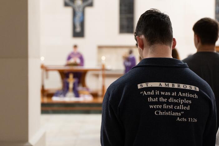 Wednesday night Mass at St. Ambrose University attracts a congregation of mostly students. On one recent evening, they added a prayer for the university's new partnership with Mount Mercy University.