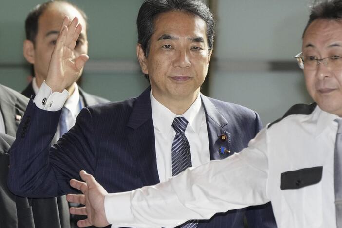 Japan's Agriculture Minister Taku Eto, center, arrives at the prime minister's office in Tokyo on Wednesday, May 21, 2025.