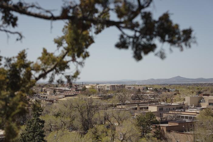 A view of Santa Fe from the Cross of the Martyrs monument in Santa Fe, New Mexico. So many Texans have fled to New Mexico's capital that some folks are calling it "Austin West".
