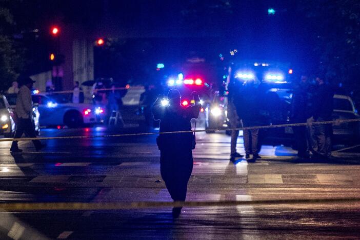 FBI agents and police officers work outside the Capital Jewish Museum in the early hours Thursday in Washington, D.C., following a shooting Wednesday night that left two people dead.