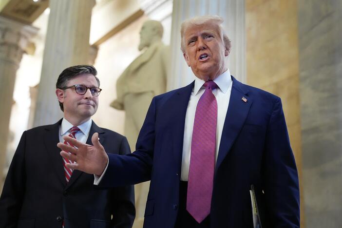 President Trump speaks alongside Speaker of the House Mike Johnson, R-La., on Capitol Hill on Tuesday. Trump was on hand to meet with House Republicans and rally support for his legislative agenda.