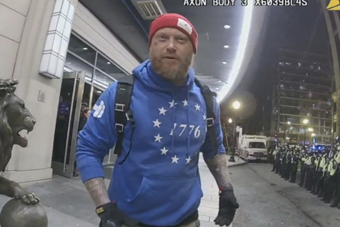 Shane Jenkins, seen here in police bodycam footage from Jan. 6, 2021, was convicted of multiple charges in connection with the Capitol riot, including assaulting police. Months after receiving a pardon from President Trump, Jenkins visited the White House along with another former Jan. 6 defendant.