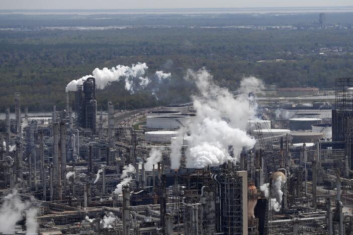 Wetlands are seen beyond a refinery in Norco, La.