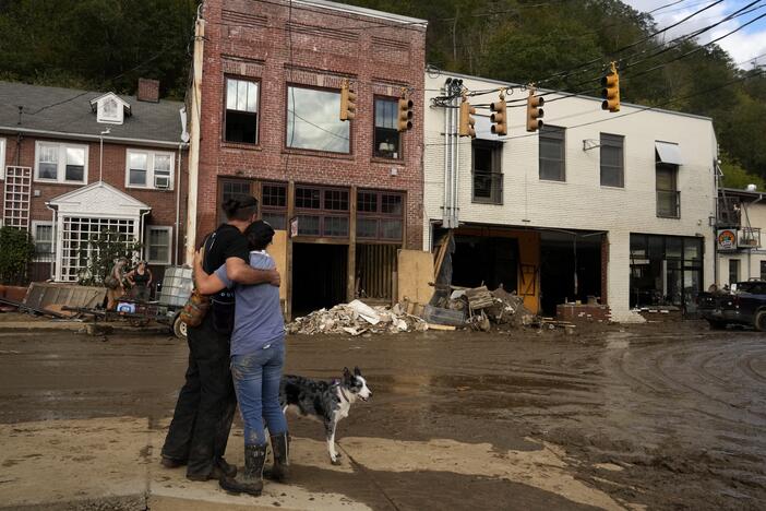 Resident Anne Schneider, right, hugs her friend Eddy Sampson as they survey damage caused by Hurricane Helene in Marshall, N.C. in 2024. Hurricanes cause billions of dollars of damage each year in the U.S. Most deaths from hurricanes are related to flooding, and many occur far from the coastline when heavy rain causes dangerous flash floods.