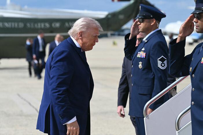 President Trump walks to board Air Force One prior to departure from Joint Base Andrews in Maryland on Friday en route to New Jersey for the weekend.