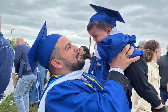 Jean Paul Al Arab and his son, 6-month-old Mtanos, celebrate the elder Al Arab's graduation from the University at Buffalo.