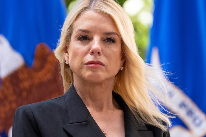 Attorney General Pam Bondi listens during a news conference at the Department of Justice on May 7, 2025 in Washington. In late April, the DOJ's Office of Justice Programs cancelled hundreds of public safety grants to local police and nonprofits, leaving many scrambling.