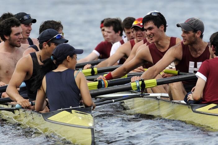 Members of Yale crew, left, and Harvard crew, right, greet one another after the 4-mile course along the Thames River for the 146th Harvard-Yale Regatta, in New London, Conn., on May 28, 2011.