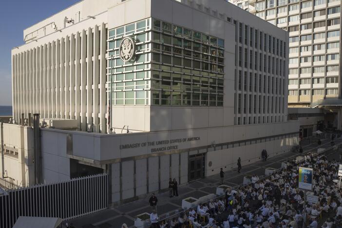 Activists sit in front of the U.S. Embassy branch office in Tel Aviv, Israel, during a protest on Jan. 8, 2025.
