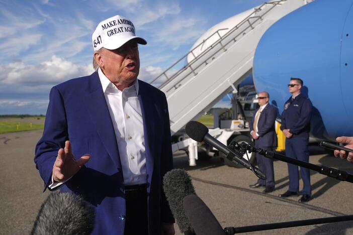 President Trump speaks to reporters before boarding Air Force One at Morristown Municipal Airport in Morristown, N.J., on Sunday.