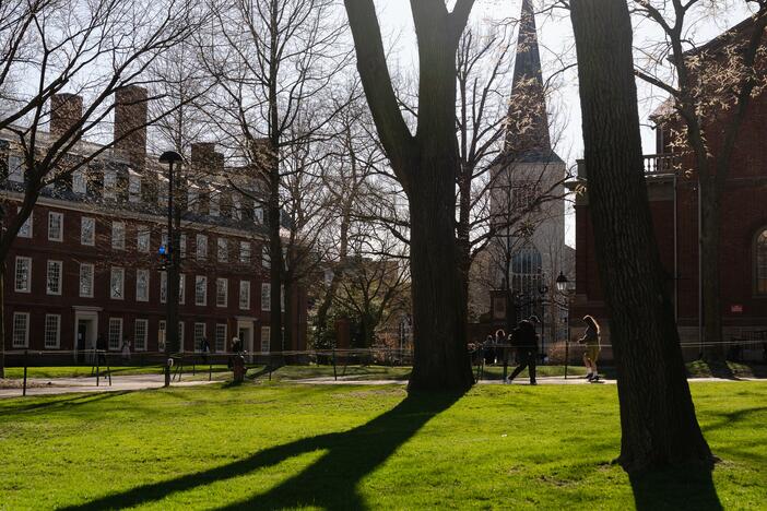 People walk through the campus of Harvard University in Cambridge, Massachusetts on April 17.