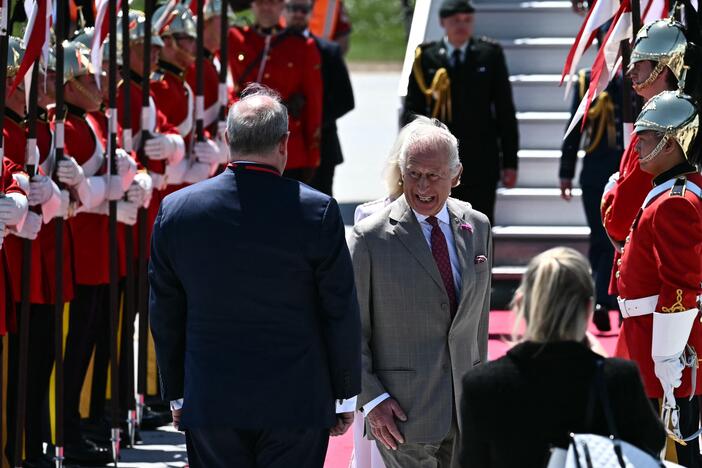 Britain's King Charles III is greeted by an honor guard after arriving at Macdonald-Cartier International Airport in Ottawa, Canada, on Monday.