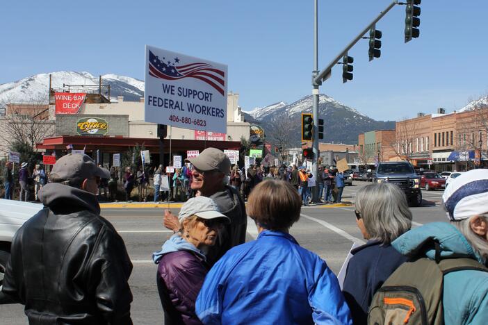 Hundreds of people join a protest in downtown Hamilton, Mont., in April supporting the work of federal employees as President Donald Trump oversees efforts to restructure the nation's government. Federal scientific research and forestry work are part of this small town's economic bedrock.