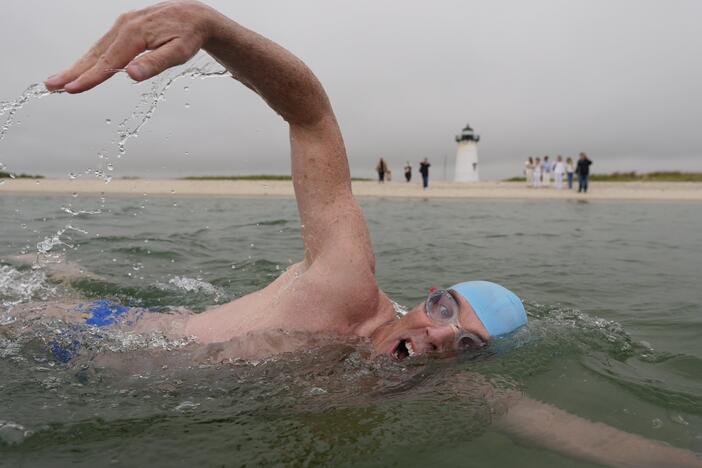 Endurance swimmer Lewis Pugh swims near the Edgartown Harbor Light on Thursday in Edgartown, Mass.
