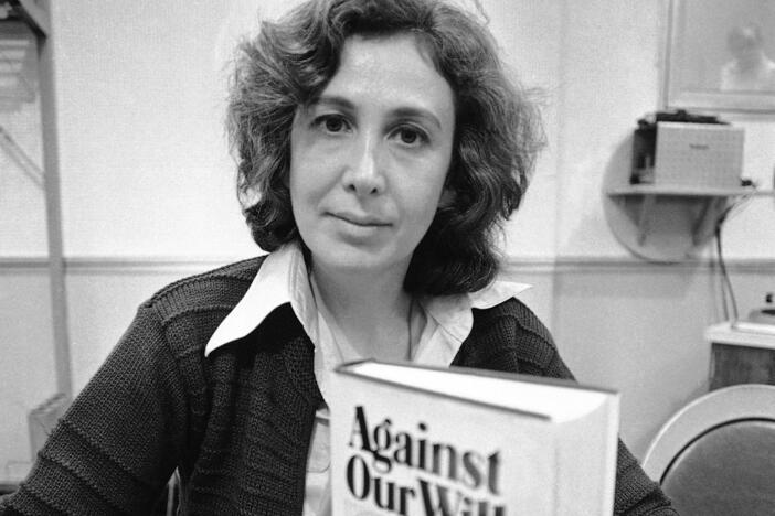Susan Brownmiller poses with her book in New York, Oct. 18, 1975.