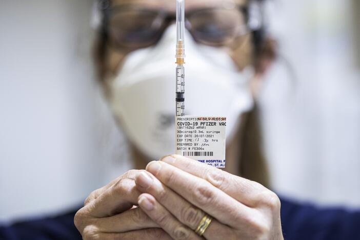 Staff seen preparing Pfizer vaccine doses inside the Melbourne Showgrounds COVID-19 Vaccination Centre on July 20, 2021, in Melbourne, Australia.