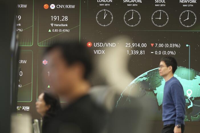 The screens show the foreign exchange rates at a dealing room of Hana Bank in Seoul, South Korea, on Wednesday.