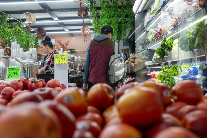 People shop for food in a Brooklyn neighborhood that has a large immigrant population on October 16, 2023 in New York City.