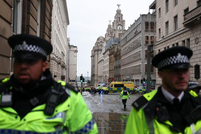 A large emergency service presence is pictured in Liverpool, England, on Monday, after a car collided with pedestrians during a parade.