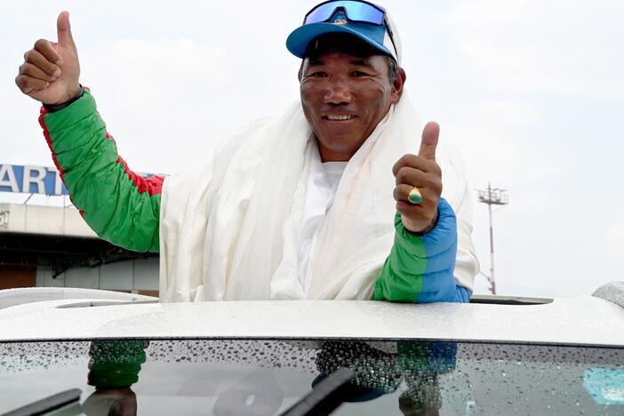 Mountaineer Kami Rita Sherpa broke his own record after climbing Mount Everest for the 31st time. He's seen here last year, acknowledging a crowd that celebrated his then-record 30th summit of Everest.