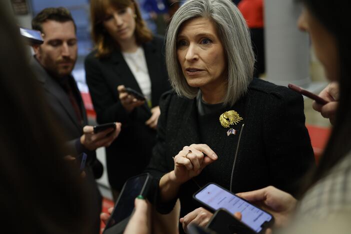 U.S. Sen. Joni Ernst, R-Iowa, speaks to reporters as she walks to a Senate luncheons at the U.S. Capitol on Nov. 19, 2024.