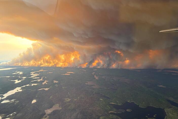 Clouds of wildfire smoke like this one in Flin Flon, Manitoba, are wafting into the Northern Plains and Midwest.