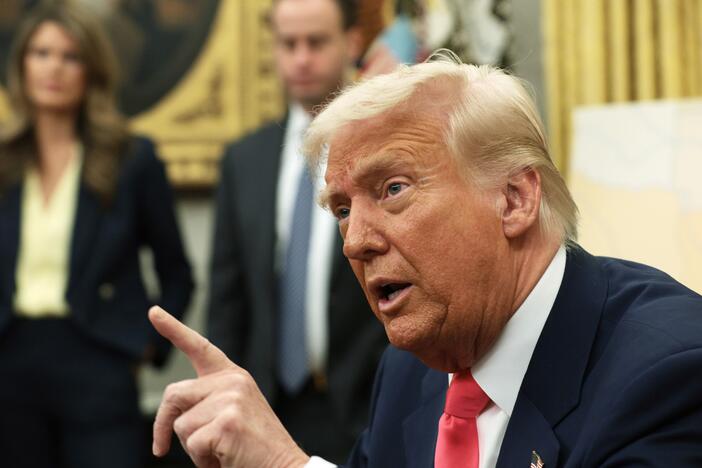 President Trump speaks after signing executive orders in the Oval Office in March 2025, including terminating the security clearances of those who work at the law firm Perkins Coie.