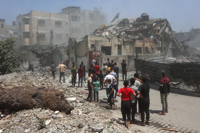 Palestinians inspect the rubble following Israeli strikes on in Gaza City on Saturday.