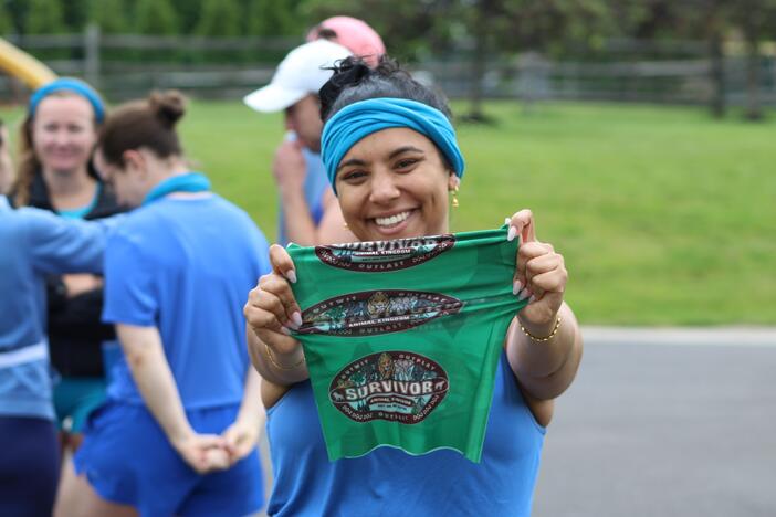 <em>All Things Considered</em> producer Mia Venkat holding up the "buff" her friends made for their <em>Survivor </em>games.